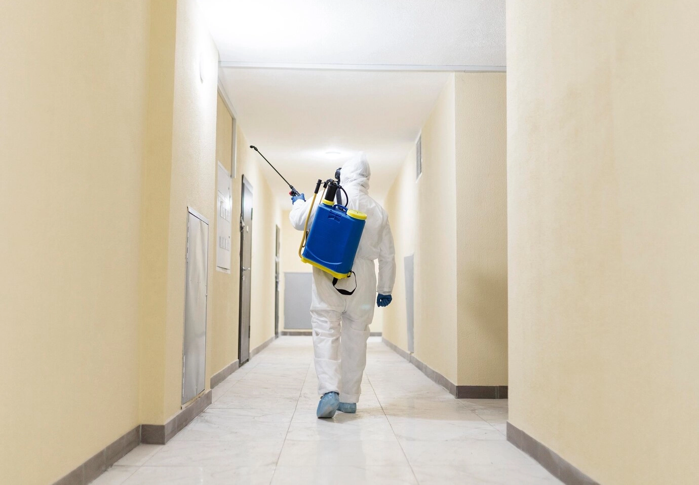 Full shot man wearing protection suit1